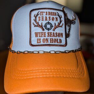 Trucker hat with iron on patches and embelishments